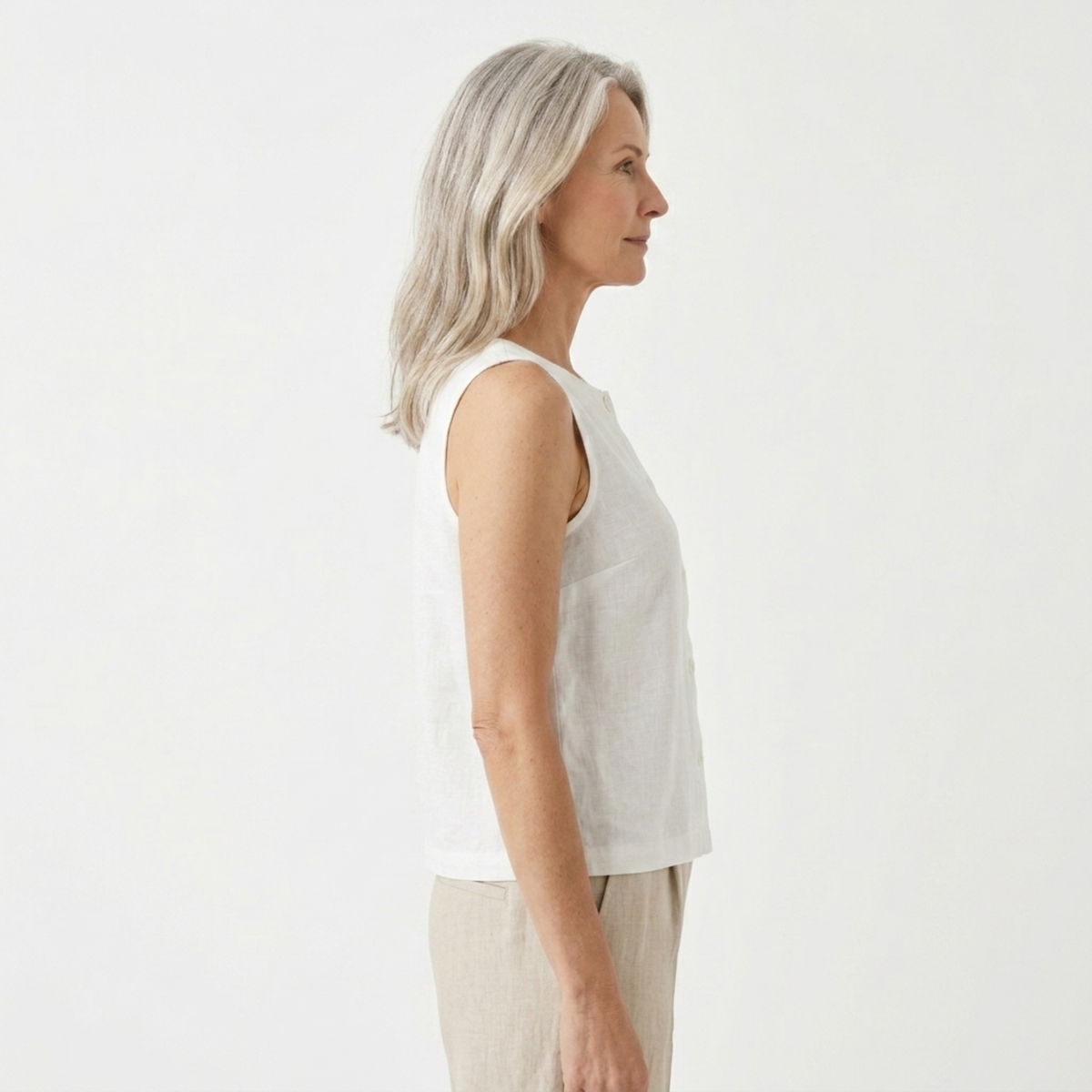 Women's crop top in pure linen with asymmetric hem — summer vacation