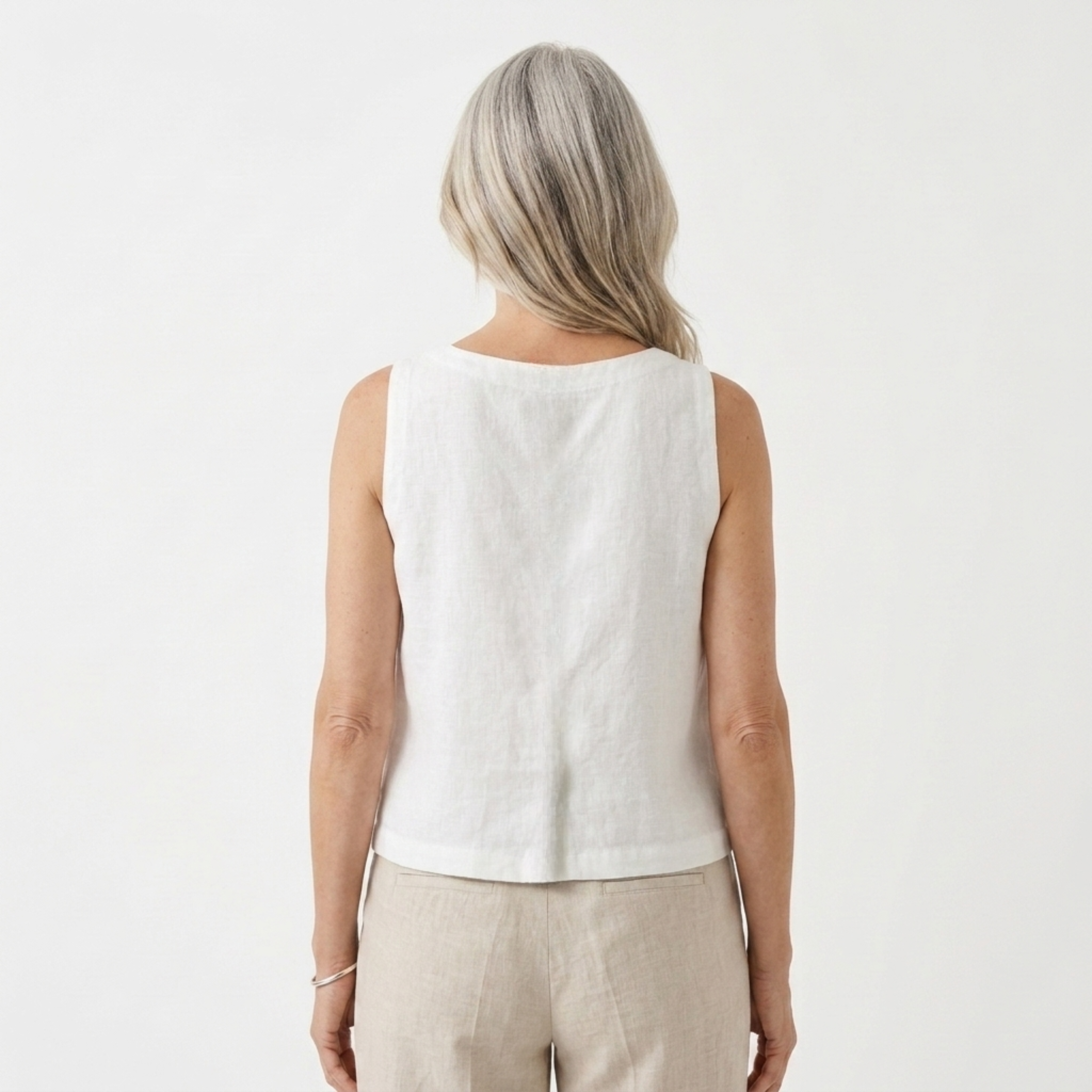 Women's crop top in pure linen with asymmetric hem — summer vacation