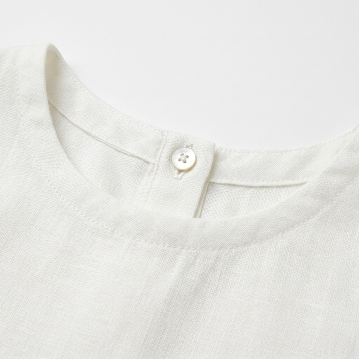 Women's crop top in pure linen with asymmetric hem — summer vacation
