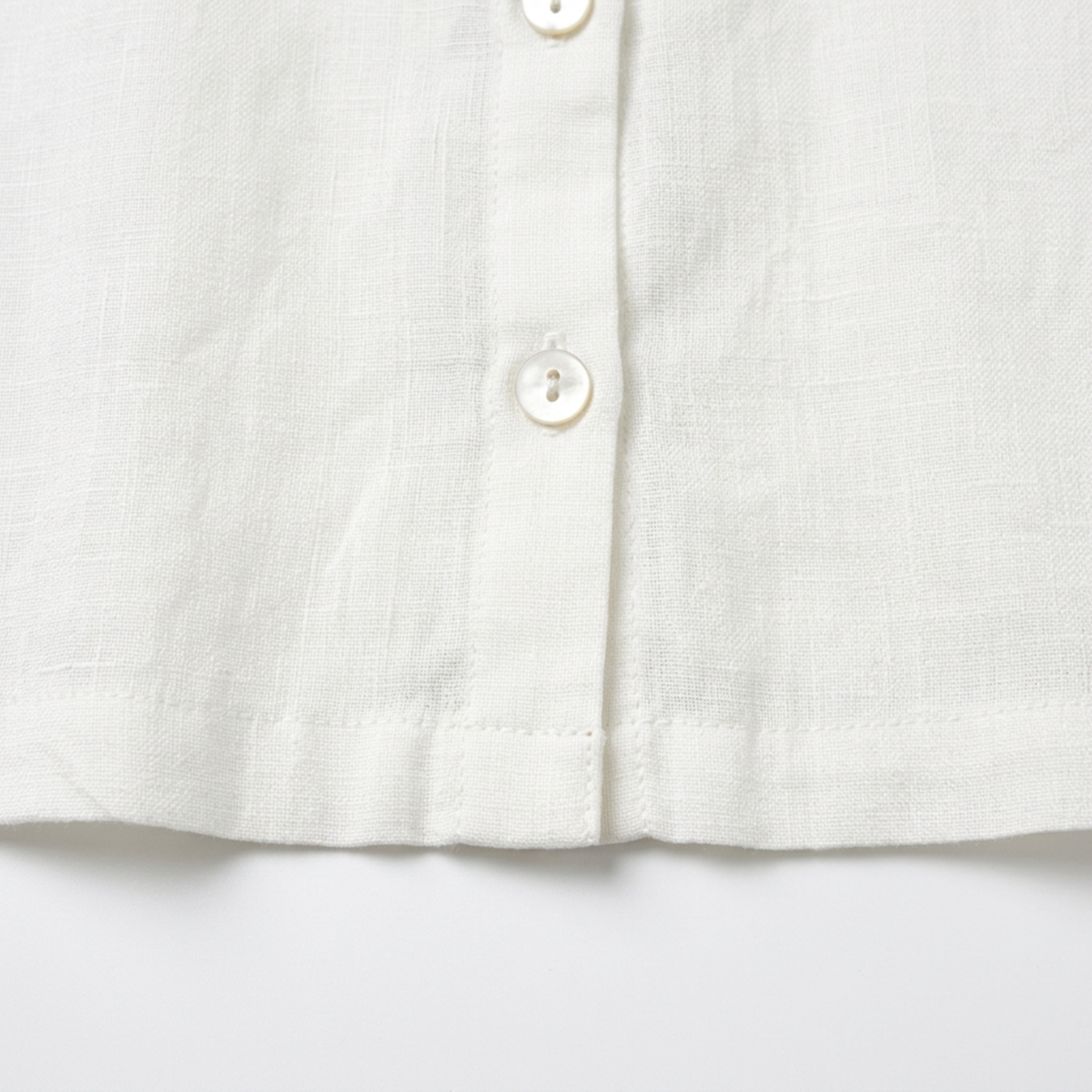 Women's crop top in pure linen with asymmetric hem — summer vacation